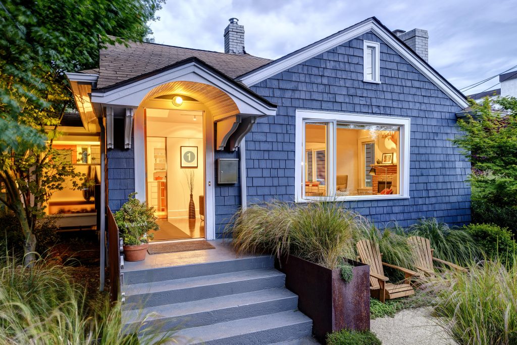 illuminated front stoop and of blue house 2025 04 03 23 28 33 utc min