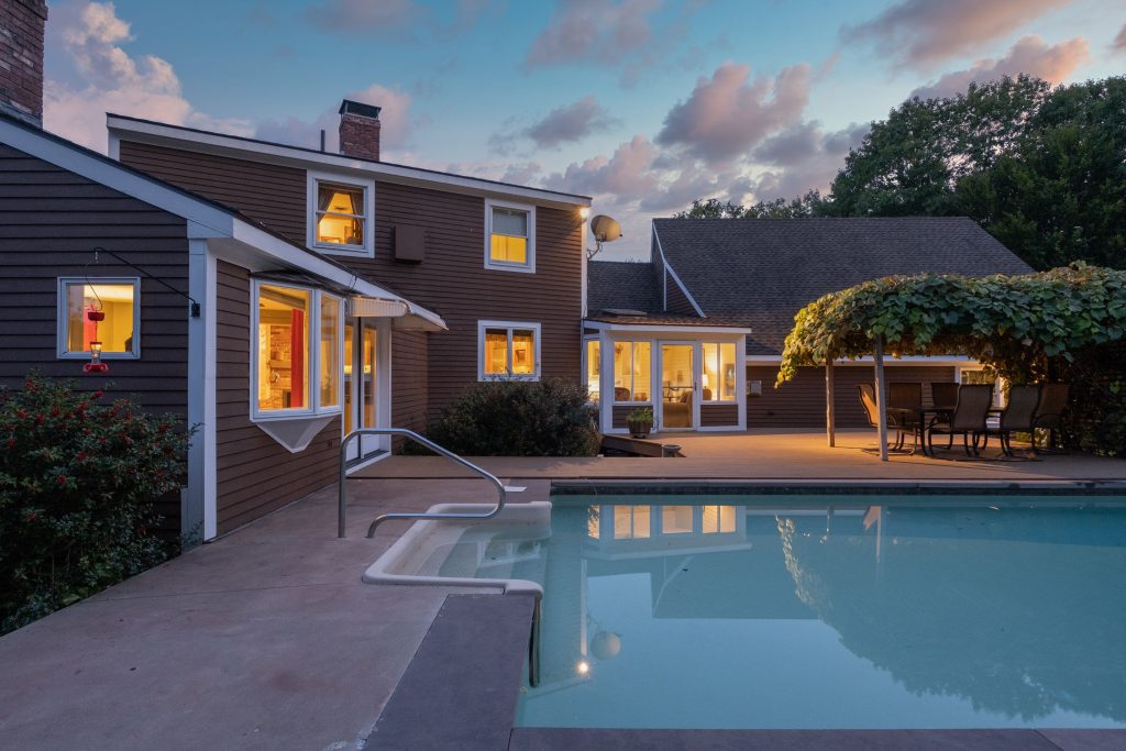 modern cozy lit house and a pool under a cloudy sk 2025 02 11 23 54 42 utc min